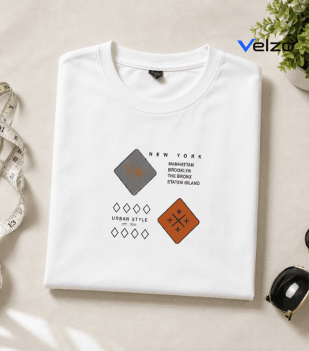 folded white t-shirt with New York urban graphic design flat lay
