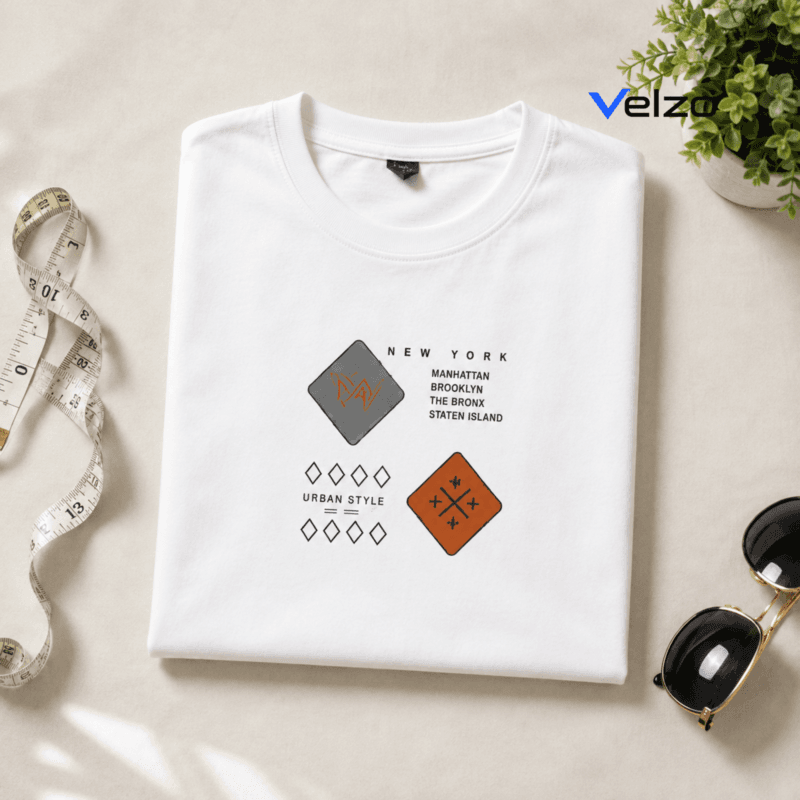 folded white t-shirt with New York urban graphic design flat lay